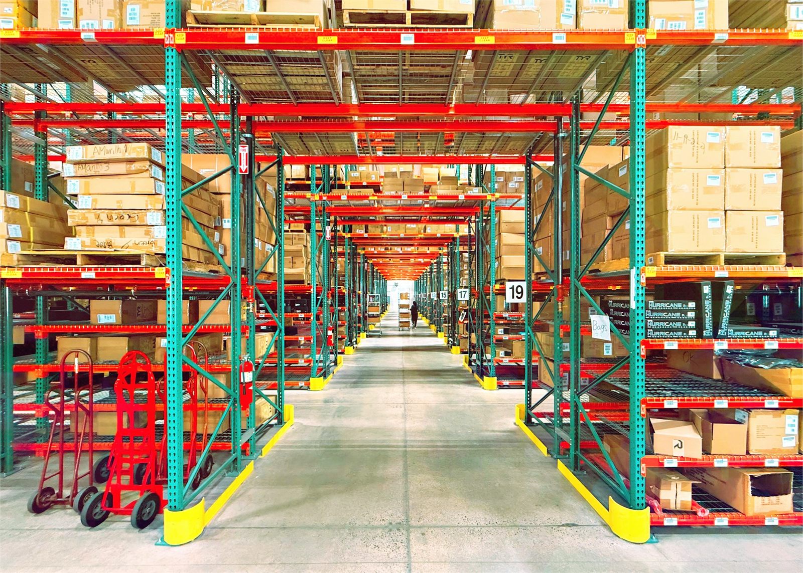 Warehouse storage aisle lined with tall racking